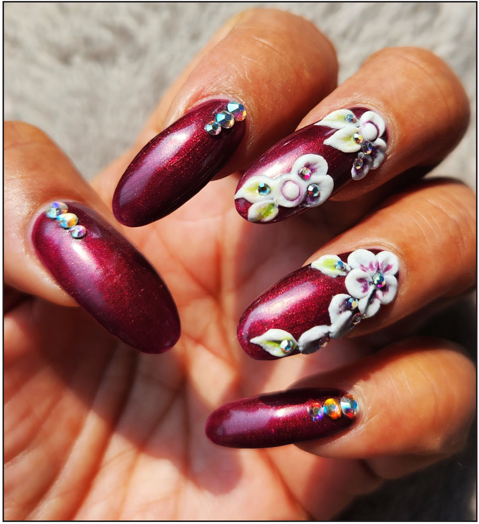 Artificial nails with nail adornments